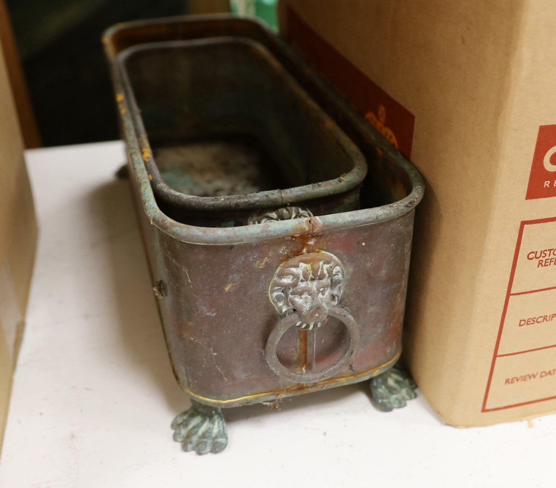 Two Victorian graduated copper tough shaped planters, largest 39cms wide